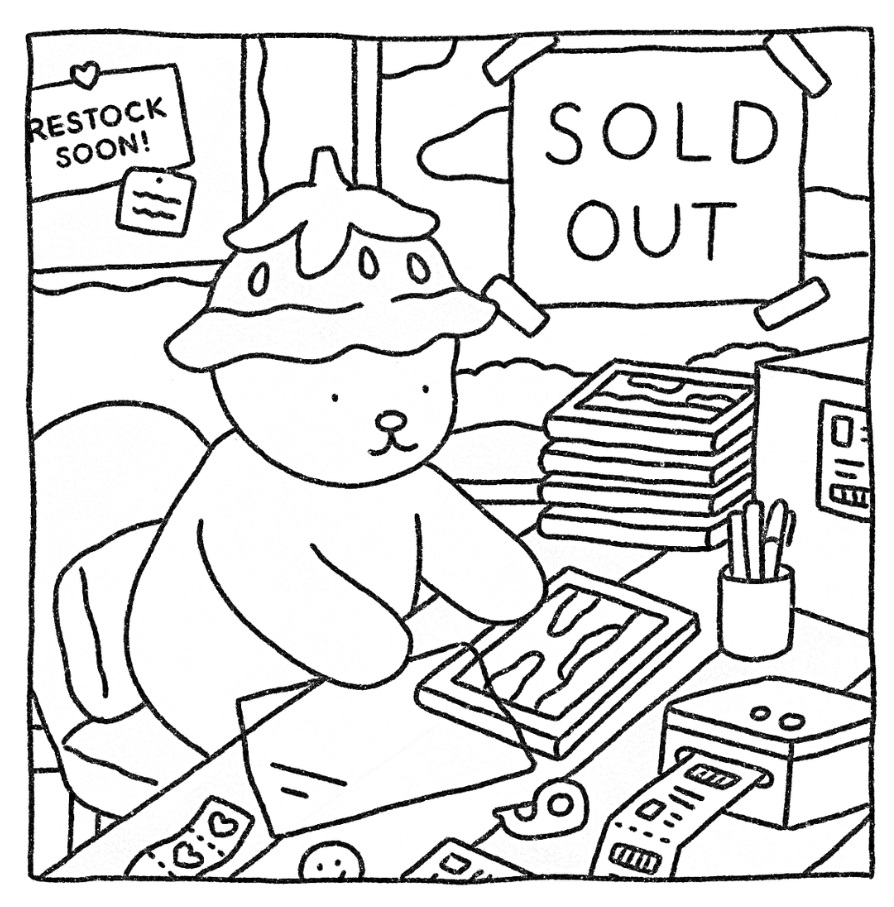 Desenho de Natal da Bobbie Goods com ursinho trabalhando, mesa cheia de itens de escritório e plaquinhas de 'SOLD OUT' e 'RESTOCK SOON!' para colorir.